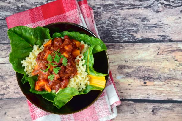 Cooked red kidney beans sweet potato tomato chili, brown rice, spinach and kale