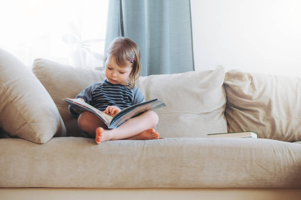 istock Girl reading at home. 1253500006