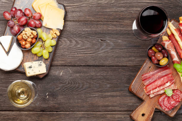istock Cheese, meat, grapes and olives antipasto 1253501566