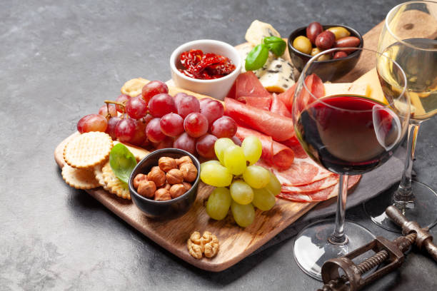 istock Cheese, meat, grapes and olives antipasto 1253501583