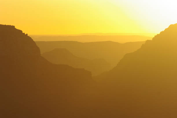 Stunning sunrise creates layers of color at the Grand Canyon Stunning sunrise creates layers of color at the Grand Canyon yaki point stock pictures, royalty-free photos & images