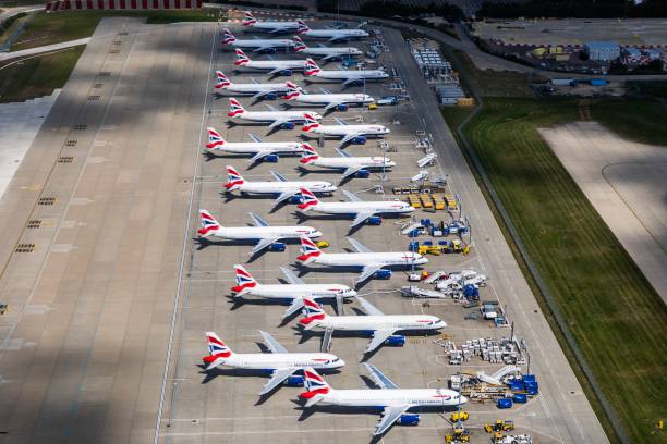 Parked British Airways Airplanes at Gatwick Airport due to COVID19 Parked British Airways Airplanes at Gatwick Airport due to COVID19, a mix of Airbus A320s and Airbus A319s. gatwick airport photos stock pictures, royalty-free photos & images