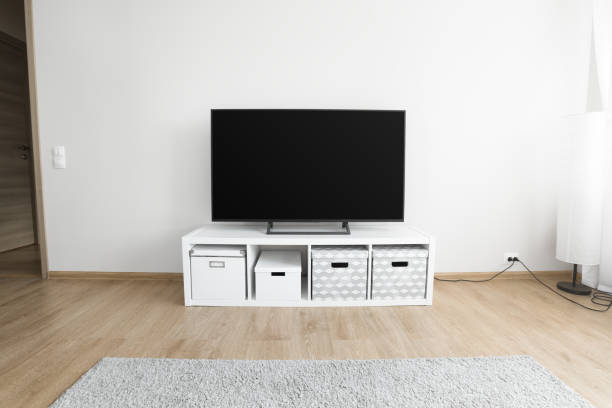 istock Lcd tv on white shef at modern room interior 1253503723