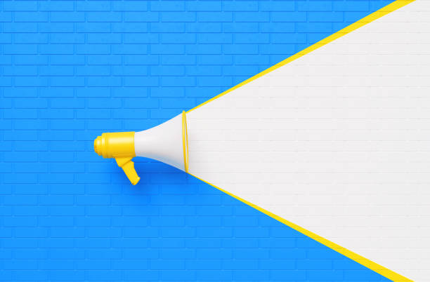 istock Yellow Megaphone on White and Blue Wall Background 1253504267