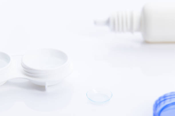 istock lenses and contact lens case on white background selective focus. 1253504364