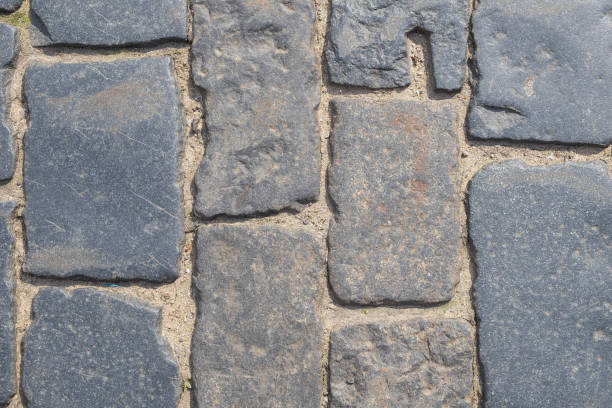 istock Fragment of a cobblestone pavement. 1253504371