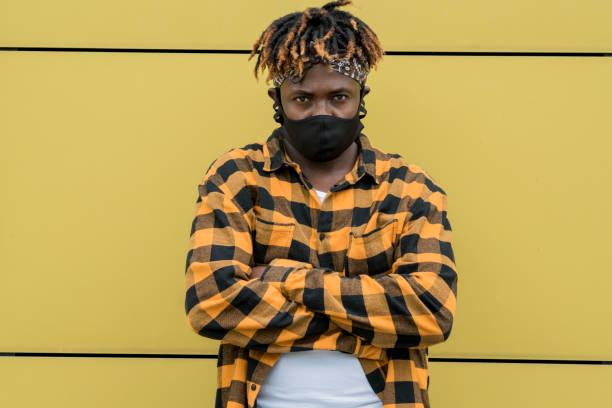 istock Latino dreadlocks man wears mask 1253504404