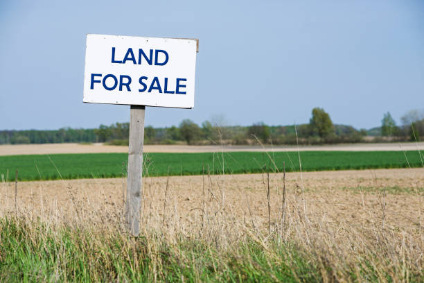 A sign is in front of the land.