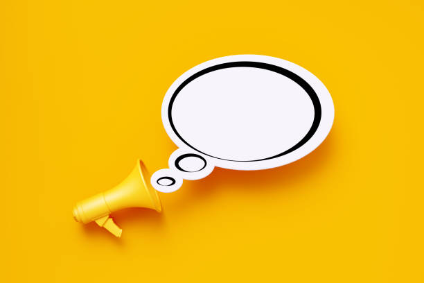 istock Yellow Megaphone and White Blank Chat Bubble over Yellow Background 1253506556