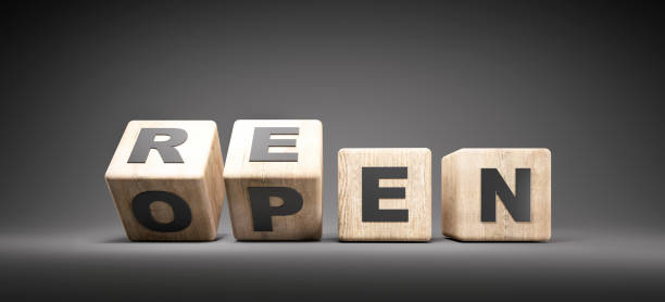istock Wooden Dice showing the word reopen 1253508705
