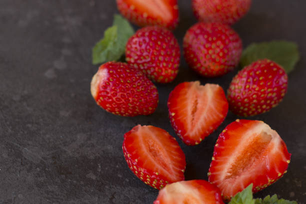istock Fresh juicy  strawberry on a dark background. 1253510660