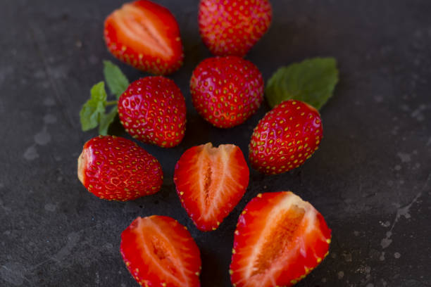 istock Fresh juicy  strawberry on a dark background. 1253510664