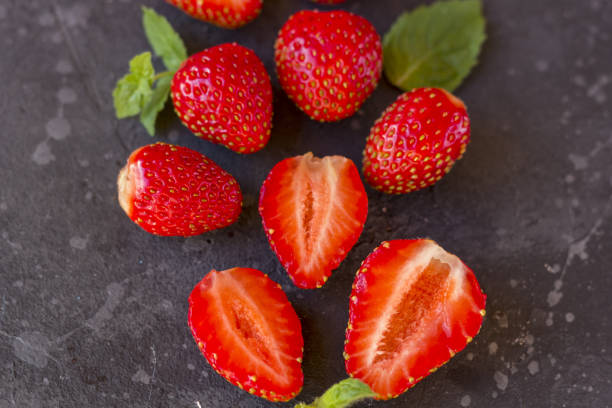 istock Fresh juicy  strawberry on a dark background. 1253510673