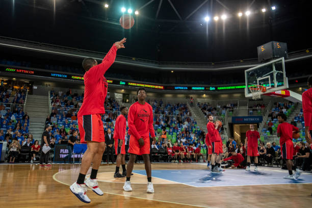 istock Basketball players practising on court 1253511856