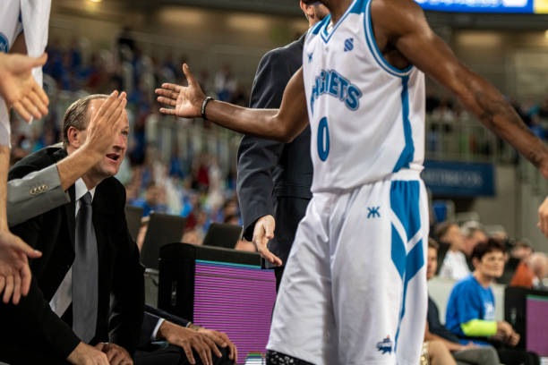 istock Basketball player giving high five to coach 1253511857