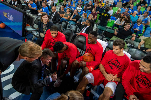 Coach giving instructions to basketball team