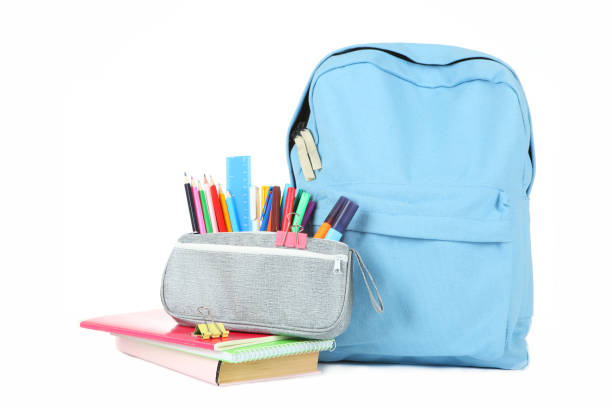 istock backpack and school stationery isolated on white 1253514932