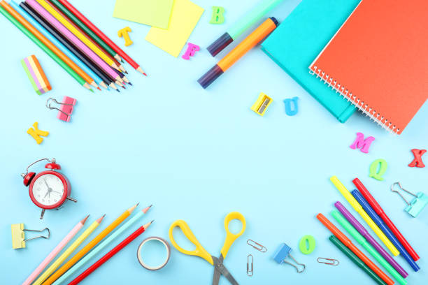 istock School office on a colored background top view. Office office, student office. Concept back to school. place for text. Flatlay 1253514934