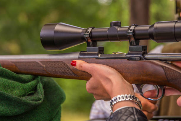 istock Woman holds rifle 1253515037
