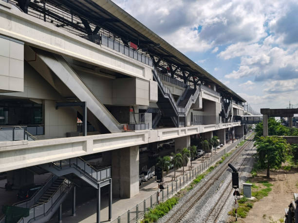 istock Architecture construction of elevator, escalator stairs and sky walk way, walk bridge between sky train station and department store mall 1253515521