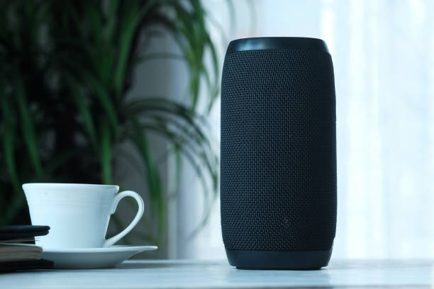 istock smart speaker and tea cup on wooden table 1253515612