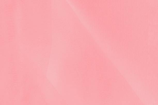 istock Pink coral color texture background with mesh fabric pattern 1253515667