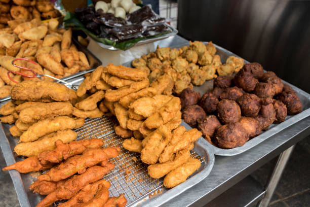 istock Indian breakfast traditional samosa dosa vadai brown balls deep fried. 1253516649