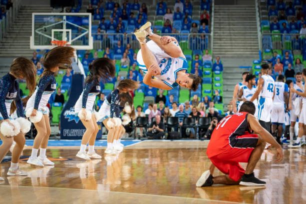 istock Cheerleaders performing on basketball court 1253517005