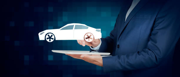 istock man hand tablet and car in screen 1253518127