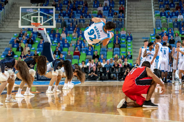 istock Cheerleaders performing on basketball court 1253518316