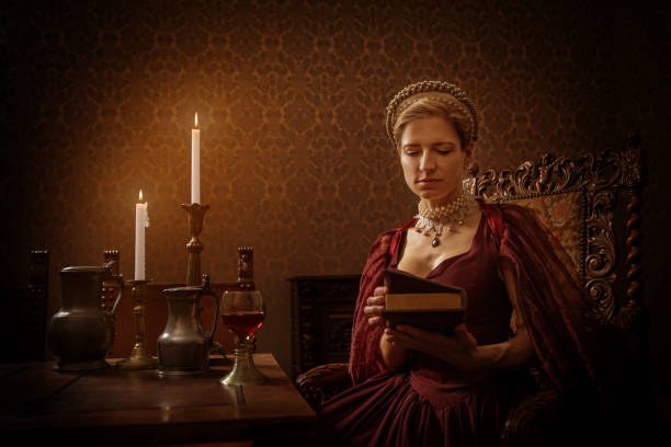 Portrait of a beautiful historical dutch noble woman by candlelight Portrait of a beautiful historical dutch noble woman wearing historically correct outfit by candlelight in a typical townhouse drawing room cosplay photos stock pictures, royalty-free photos & images