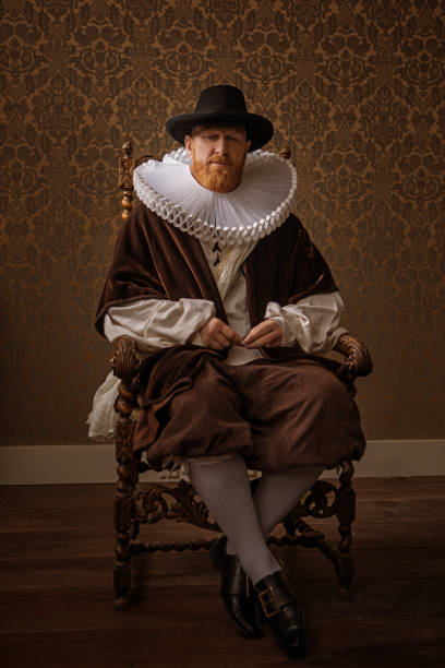 Portrait of a Redhead traditional dutch nobleman Portrait of a handsome redhead traditional dutch nobleman wearing historically correct outfit in a typical townhouse drawing room neck ruff stock pictures, royalty-free photos & images