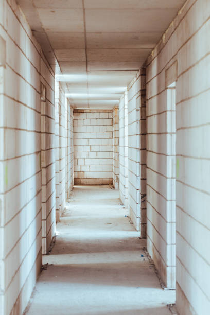 istock Construction, not completed corridor and exits to further rooms 1253524063