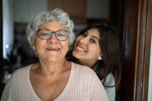Portrait of grandmother and granddaughter at home Portrait of grandmother and granddaughter at home hispanic grandmother stock pictures, royalty-free photos & images