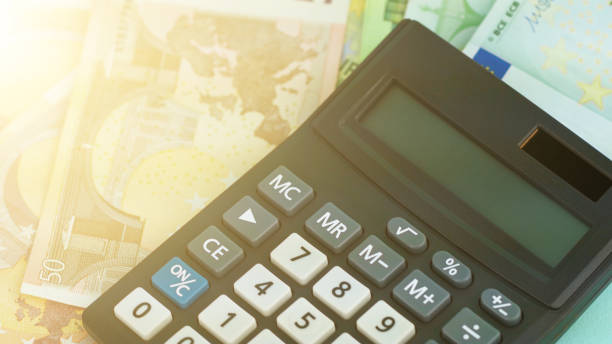istock black calculator with grey and white buttons on banknotes 1253525010