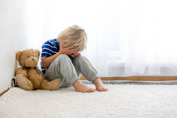 istock Child, toddler boy, punished in the corner for mischieves 1253526190