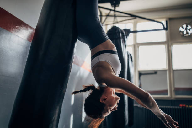 istock Female boxer exercising alone in gym 1253527487