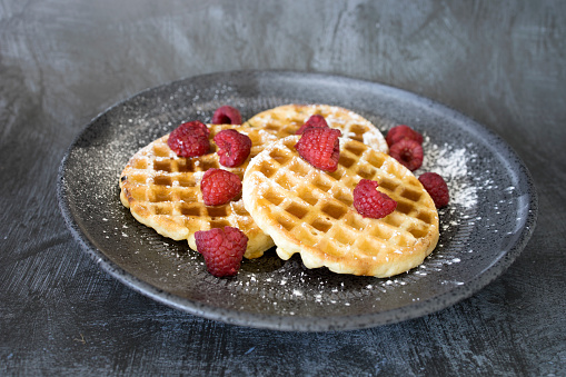 Making Waffles with Fresh Berries in Domestic Kitchen