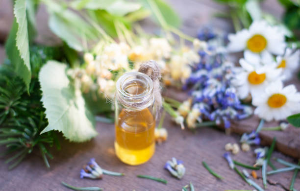 istock Essential oil in glass bottle with fresh ingredients 1253527677