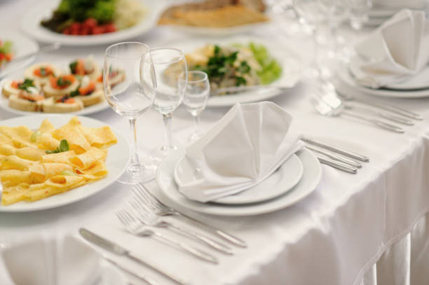 istock table set service with silverware and glass stemware at restaurant before party 1253530724
