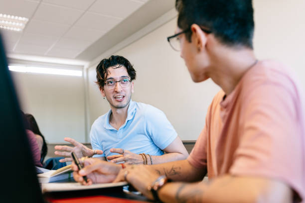 University Students in Classroom Diverse University Students in Classroom high school student classroom education student stock pictures, royalty-free photos & images