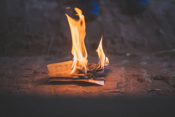 istock Piece of paper, burning on the floor 1253537165