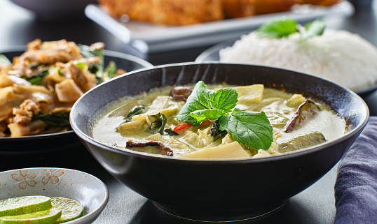 thai green curry with chicken and eggplant in bowl close up