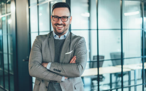 istock Confident and smiling businessman 1253539176