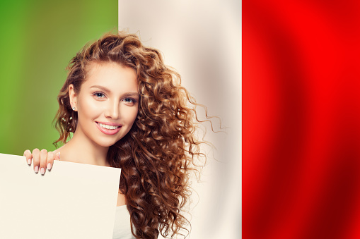 Love Italy concept. Happy woman with white banner and Italian flag