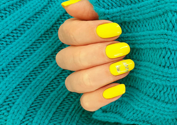 istock female hand nail beautiful manicure sweater 1253541393