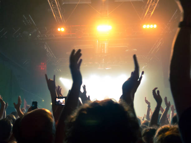 istock Filming concert on smart phone 1253542009