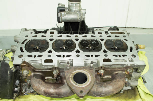 istock Top view of the removed and inverted engine cylinder head, which is lying on the table 1253543114