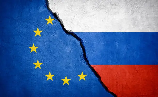 EU and Russia conflict. Country flags on broken wall. Illustration.