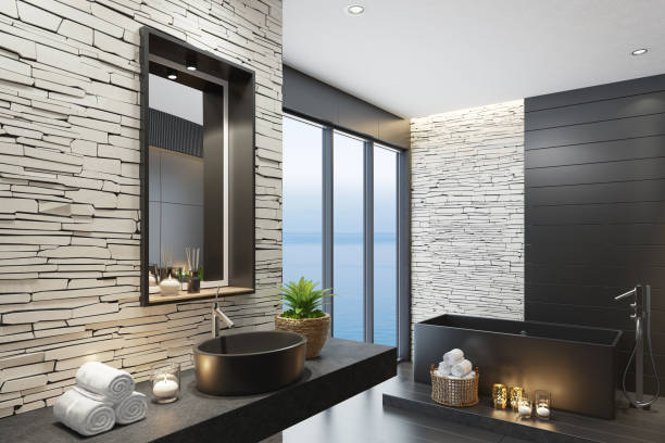istock Luxurious modern home spa bathroom with matte white stacked stone wall and squared black matte mirror 1253545401